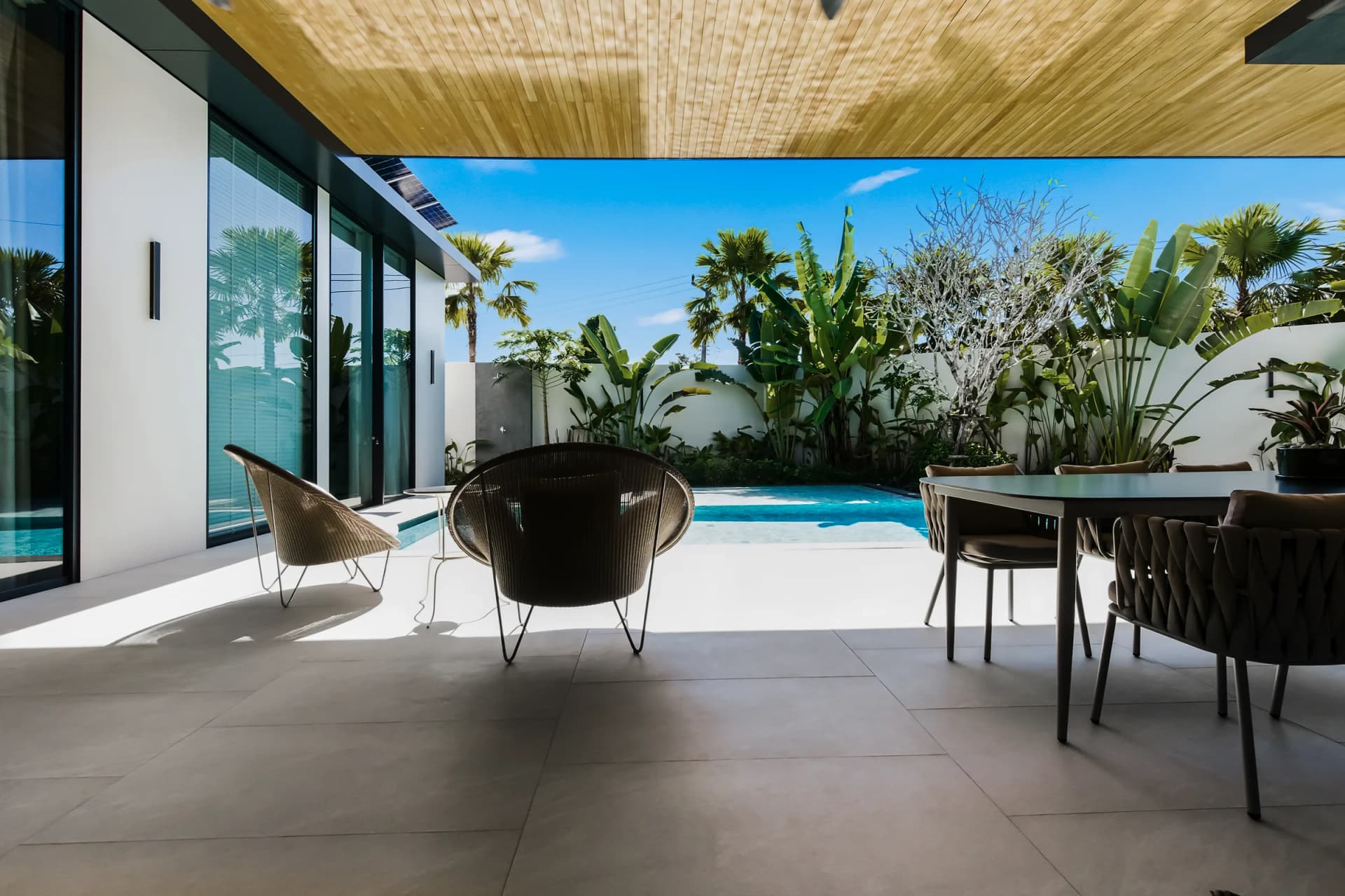 Villa 1: from the covered terrace to the pool and the garden